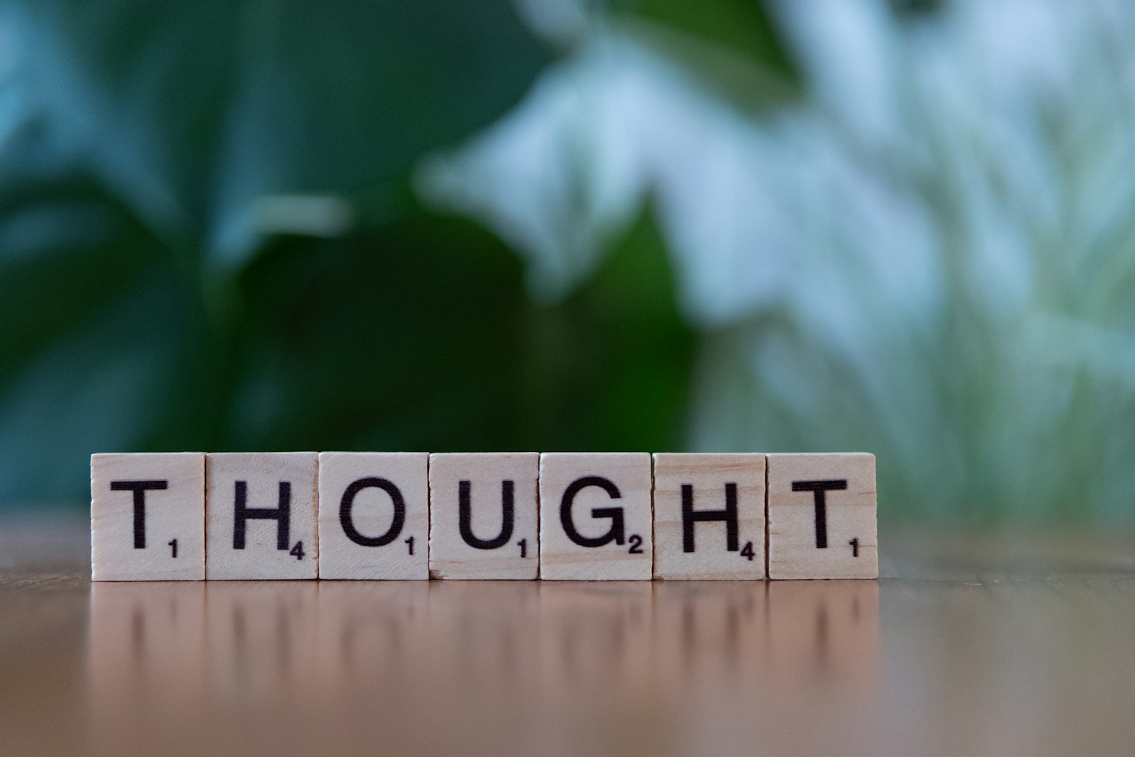 A close up of a block that says thought